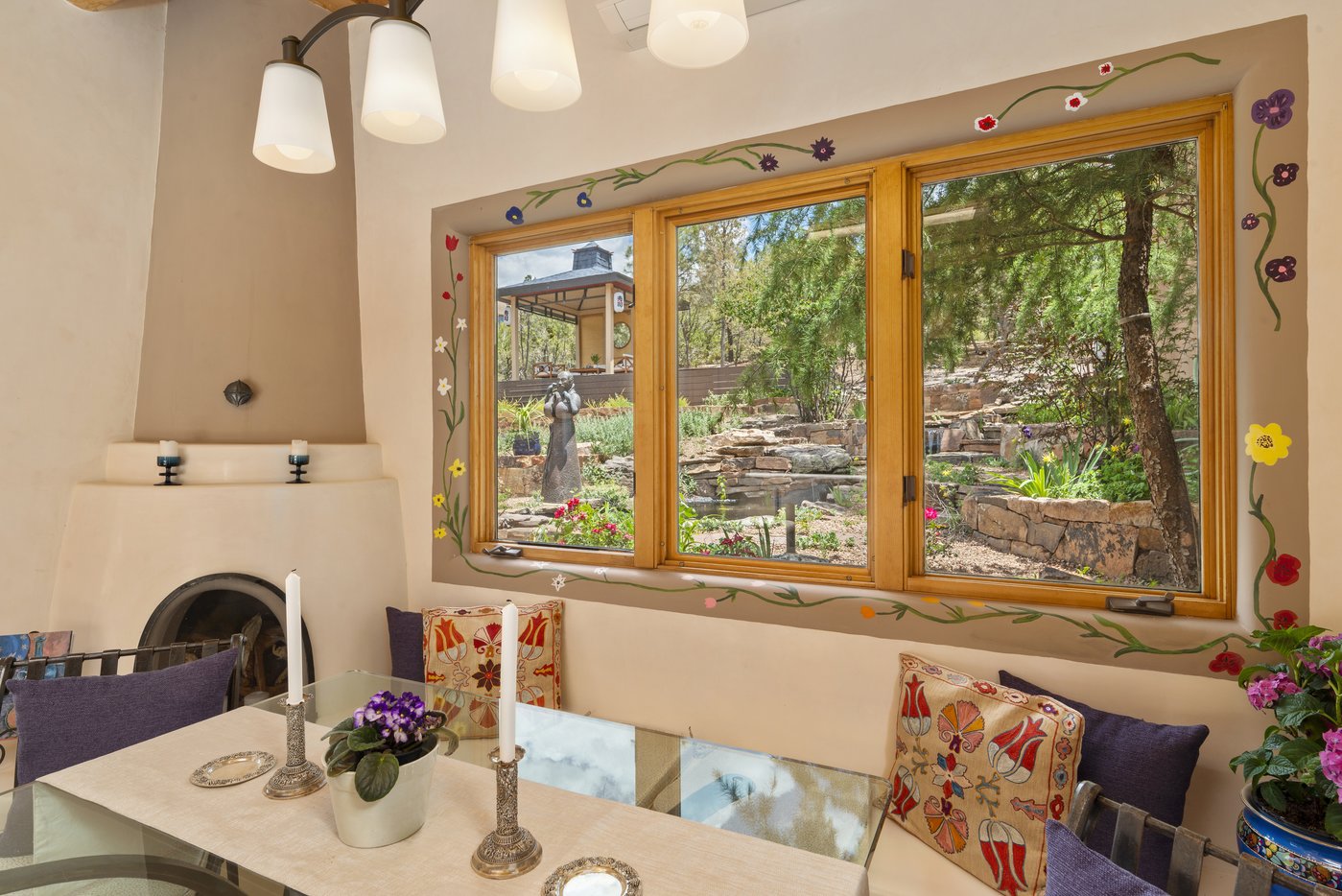 Informal dining area within kitchen with corner kiva fireplace