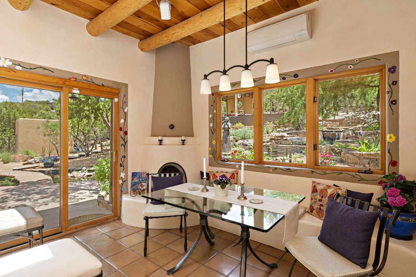 Informal dining area within kitchen with corner kiva fireplace