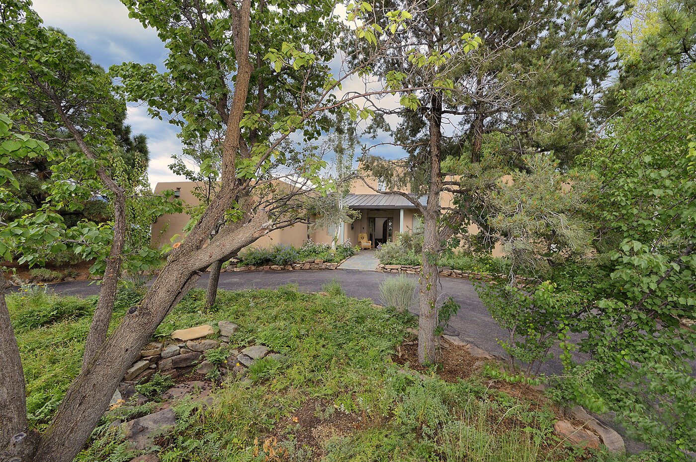 Entry, Driveway, and Island with Numerous Fruit Trees